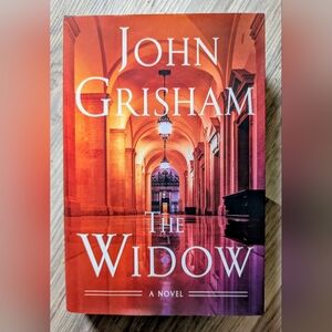 John Grisham "The Widow" Hardcover Book - Orange & Pink Cover